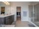 Bathroom offers a walk-in shower, modern vanity, and an open doorway to the closet at 3008 Blithe Pt, Castle Rock, CO 80108