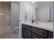 Bright and modern bathroom with stylish vanity, mirror, and combination shower and tub at 3008 Blithe Pt, Castle Rock, CO 80108