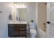 Bright bathroom featuring a vanity with storage, toilet, and shower-tub combo at 3008 Blithe Pt, Castle Rock, CO 80108