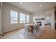Dining room features a rustic wood table, a decorative fireplace, and plenty of natural light at 3008 Blithe Pt, Castle Rock, CO 80108