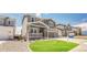 Beautiful two-story home boasts a manicured lawn and inviting front porch, perfect for relaxing outdoors at 3008 Blithe Pt, Castle Rock, CO 80108