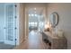 Bright and spacious foyer features a high ceiling, wood floors, and modern decor at 3008 Blithe Pt, Castle Rock, CO 80108