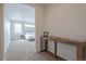 Hallway view leading to a bedroom with a comfortable bed and minimalist decor at 3008 Blithe Pt, Castle Rock, CO 80108