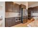 Modern kitchen showcases stainless steel appliances, ample cabinets, and sleek countertops at 3008 Blithe Pt, Castle Rock, CO 80108