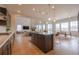 Open-concept kitchen features a large island, modern appliances, and easy access to living spaces at 3008 Blithe Pt, Castle Rock, CO 80108