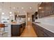 Well-equipped kitchen features a spacious island, modern appliances, and stylish finishes at 3008 Blithe Pt, Castle Rock, CO 80108