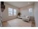 Bright living room with a comfortable sectional sofa, a neutral rug, and large windows at 3008 Blithe Pt, Castle Rock, CO 80108