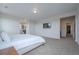 Large main bedroom offers ample space, neutral tones, and a flat screen tv at 3008 Blithe Pt, Castle Rock, CO 80108