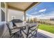 Covered patio with an outdoor dining set and grill overlooks the backyard at 3008 Blithe Pt, Castle Rock, CO 80108