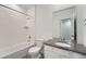 Clean bathroom with single vanity, tub, and shower at 1926 S Haleyville Way, Aurora, CO 80018