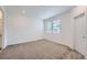 Spacious living room with neutral carpeting and large windows at 1926 S Haleyville Way, Aurora, CO 80018