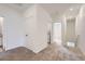 Upstairs hallway with carpet, linen closet, and laundry area at 1926 S Haleyville Way, Aurora, CO 80018