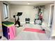 Well-equipped home gym featuring exercise bike, weights, and resistance machine at 2394 S Loveland Way, Lakewood, CO 80228