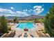 Community pool with mountain views and lounge chairs at 2394 S Loveland Way, Lakewood, CO 80228