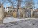 Large backyard with a concrete pad, a storage building, and wood fencing for privacy at 1475 Saint Paul St, Denver, CO 80206