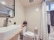 Modern bathroom featuring a vessel sink, sleek faucet, and stylish geometric patterned floor tiles at 1475 Saint Paul St, Denver, CO 80206