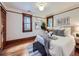 This charming bedroom features hardwood floors, natural light, modern decor, and classic architectural details at 1475 Saint Paul St, Denver, CO 80206