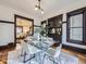 Bright dining room featuring a glass table, white chairs, and elegant decor, offering a stylish space for meals at 1475 Saint Paul St, Denver, CO 80206