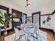 Elegant dining room with modern table and chairs, natural light, and built-in cabinets at 1475 Saint Paul St, Denver, CO 80206