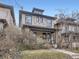 Attractive brick home featuring a traditional design with a covered porch and well-kept lawn at 1475 Saint Paul St, Denver, CO 80206