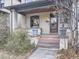 Inviting front porch with brick accents and a cozy entrance, perfect for relaxing outdoors at 1475 Saint Paul St, Denver, CO 80206