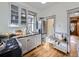 This functional kitchen showcases stainless steel appliances, wood floors, and clever storage options at 1475 Saint Paul St, Denver, CO 80206