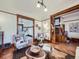 Bright living room featuring hardwood floors, wood trim, and comfortable seating in a charming home at 1475 Saint Paul St, Denver, CO 80206