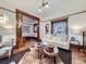 Bright and airy living room featuring wood trim, with comfortable seating and natural light at 1475 Saint Paul St, Denver, CO 80206