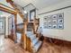 Beautiful wood staircase with detailed trim, patterned carpet, and gallery wall art at 1475 Saint Paul St, Denver, CO 80206