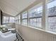 Bright sunroom features lots of windows for natural light and stylish black and white tile at 1475 Saint Paul St, Denver, CO 80206