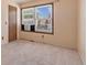 Comfortable bedroom with neutral carpet, a large window, and an air conditioning unit at 9844 Fairwood St, Littleton, CO 80125