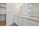 Bright bathroom with dual sinks, vanity, and ample storage space, offering convenience and functionality at 28630 E 8Th St, Watkins, CO 80137