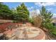 Backyard firepit featuring a circular stone patio, perfect for outdoor entertaining and relaxation at 23327 E Ottawa Dr, Aurora, CO 80016