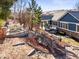 Expansive backyard with multiple entertaining areas, including a fire pit and covered patio at 23327 E Ottawa Dr, Aurora, CO 80016