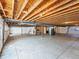 Spacious unfinished basement with open layout, utility access, and concrete floor at 23327 E Ottawa Dr, Aurora, CO 80016
