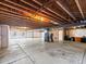 Unfinished basement featuring exposed beams, concrete floor, and utilities, ready to be customized at 23327 E Ottawa Dr, Aurora, CO 80016