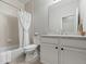 Bathroom features a shower/tub combination, single vanity, and tile flooring at 23327 E Ottawa Dr, Aurora, CO 80016