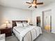 Comfortable bedroom features a ceiling fan, nightstands, and a walk-in closet for ample storage at 23327 E Ottawa Dr, Aurora, CO 80016