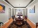 Elegant dining room with hardwood floors, tray ceiling and modern chandelier at 23327 E Ottawa Dr, Aurora, CO 80016