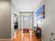 Welcoming foyer with hardwood flooring and natural light from the glass front door at 23327 E Ottawa Dr, Aurora, CO 80016