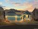 Inviting single-Gathering home with three-car garage, solar panels, and manicured front yard at sunset at 23327 E Ottawa Dr, Aurora, CO 80016
