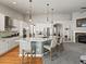 Bright kitchen featuring a large island, pendant lights, hardwood floors and stainless appliances at 23327 E Ottawa Dr, Aurora, CO 80016