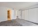 Spacious bedroom with closet doors and access to the bathroom at 9867 E Peakview Ave # E1, Englewood, CO 80111