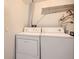 Laundry closet with washer and dryer at 9867 E Peakview Ave # E1, Englewood, CO 80111