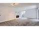 Living room featuring neutral paint, carpet, white trim, and fireplace at 9867 E Peakview Ave # E1, Englewood, CO 80111