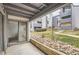 Cozy patio with sliding glass doors and views of landscaped grounds at 9867 E Peakview Ave # E1, Englewood, CO 80111