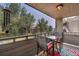 Private balcony with table and chairs, offering scenic views of the community at 23636 Pondview Pl # C, Golden, CO 80401