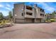 Exterior view of building with garages and landscaping at 23636 Pondview Pl # C, Golden, CO 80401