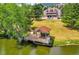 Aerial view of a pond with gazebo and walking path at 23636 Pondview Pl # C, Golden, CO 80401