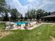 Community swimming pool with lounge chairs at 23636 Pondview Pl # C, Golden, CO 80401